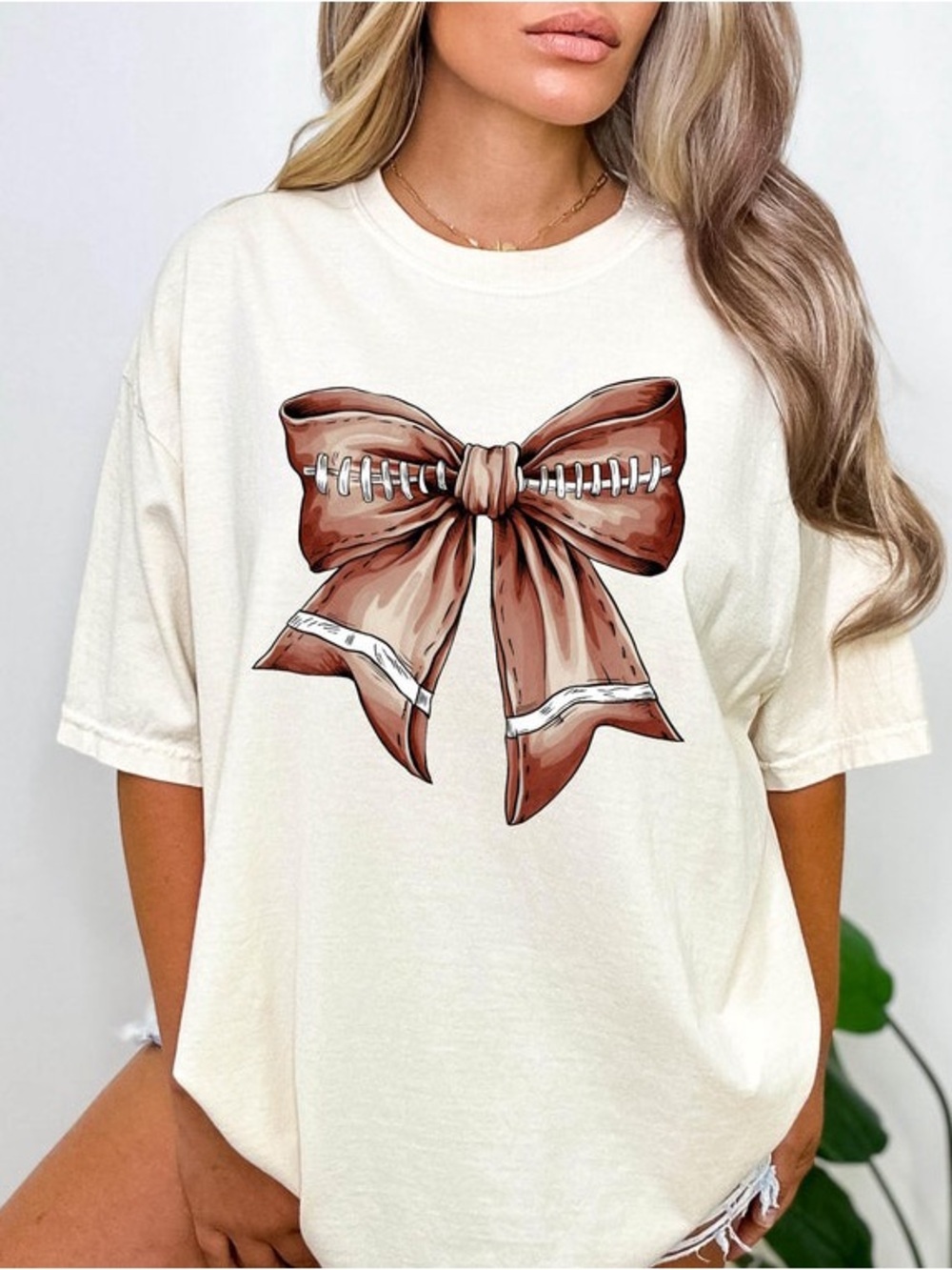 Comfort Colors football-themed bow cotton shirt